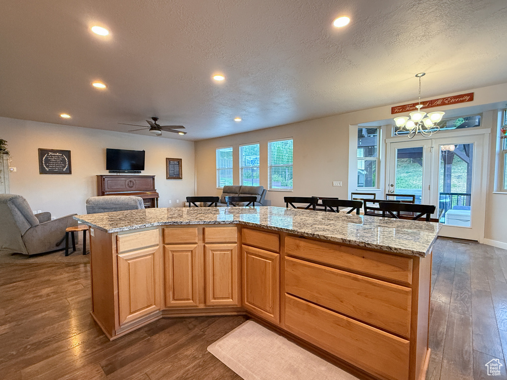 Kitchen with open floor plan, dark wood-style floors, a chandelier, recessed lighting, and ceiling fan