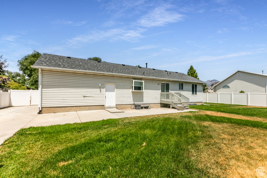 Back of property featuring a patio area