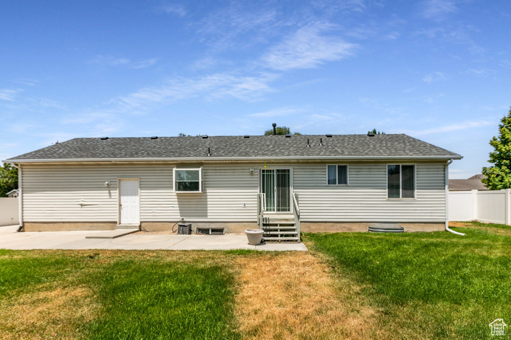 Rear view of house featuring a patio