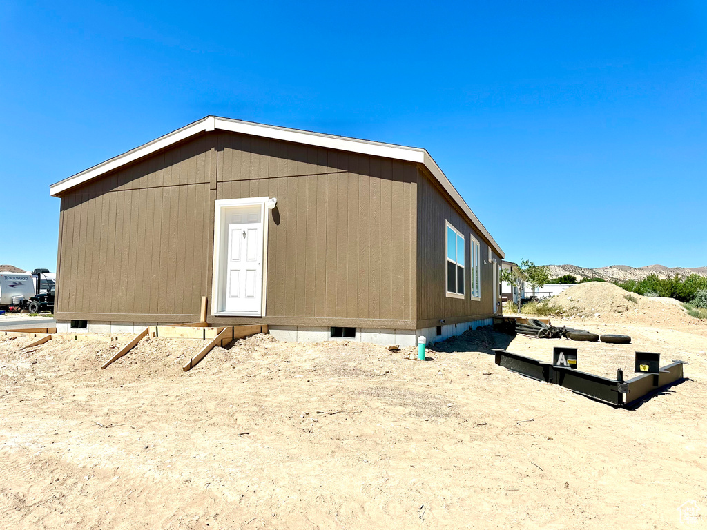 Rear view of property with a mountain view