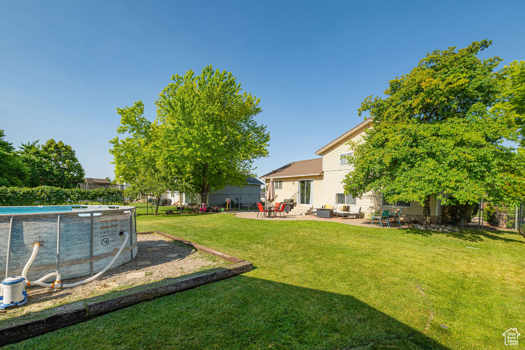 Fenced yard featuring entry steps and a patio