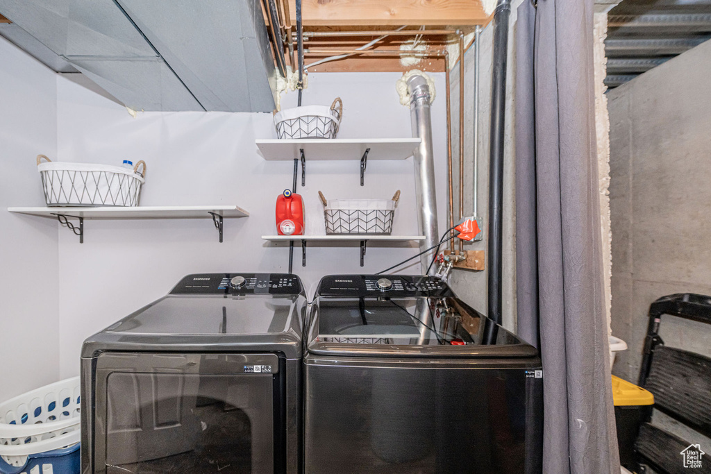 Laundry room featuring washer and clothes dryer