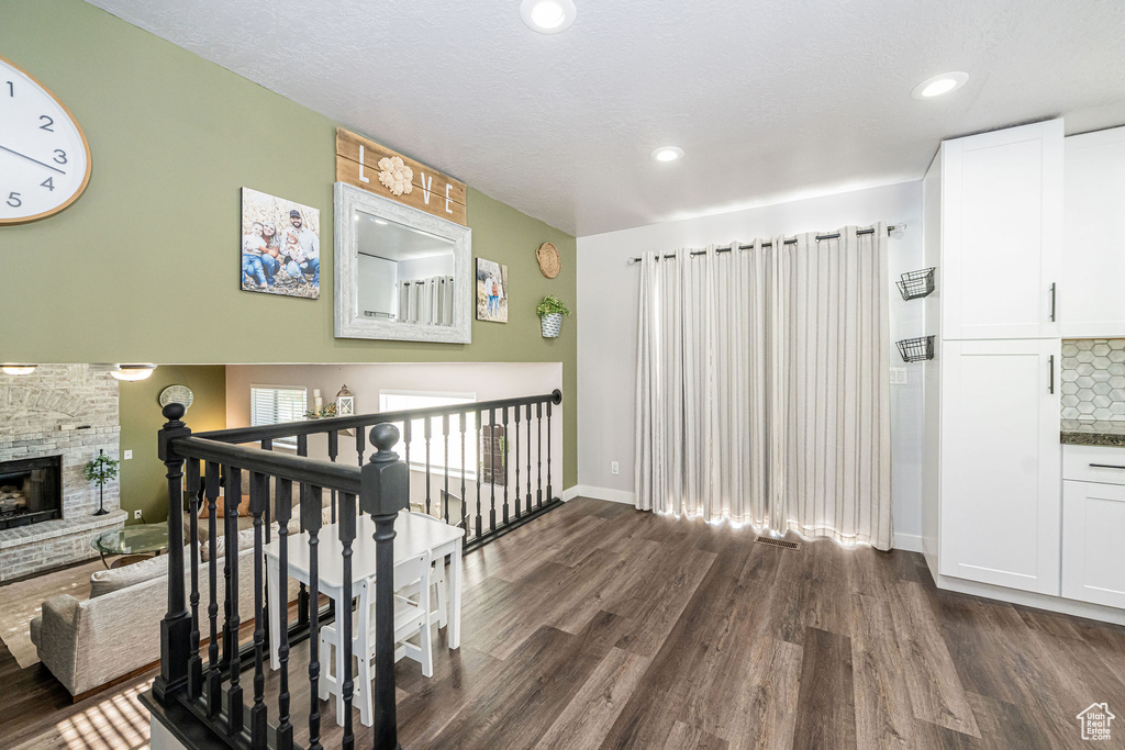 Corridor featuring dark wood-style floors and recessed lighting