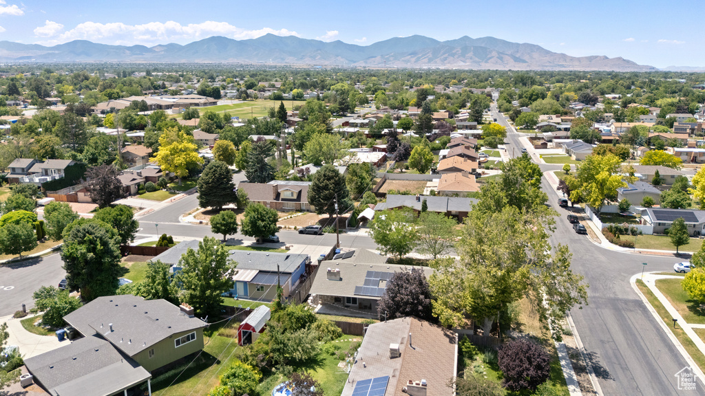 Aerial view of residential area featuring a mountain backdrop