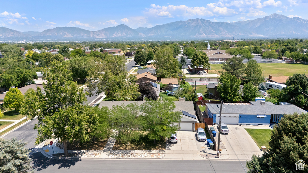 Aerial perspective of suburban area with a mountainous background