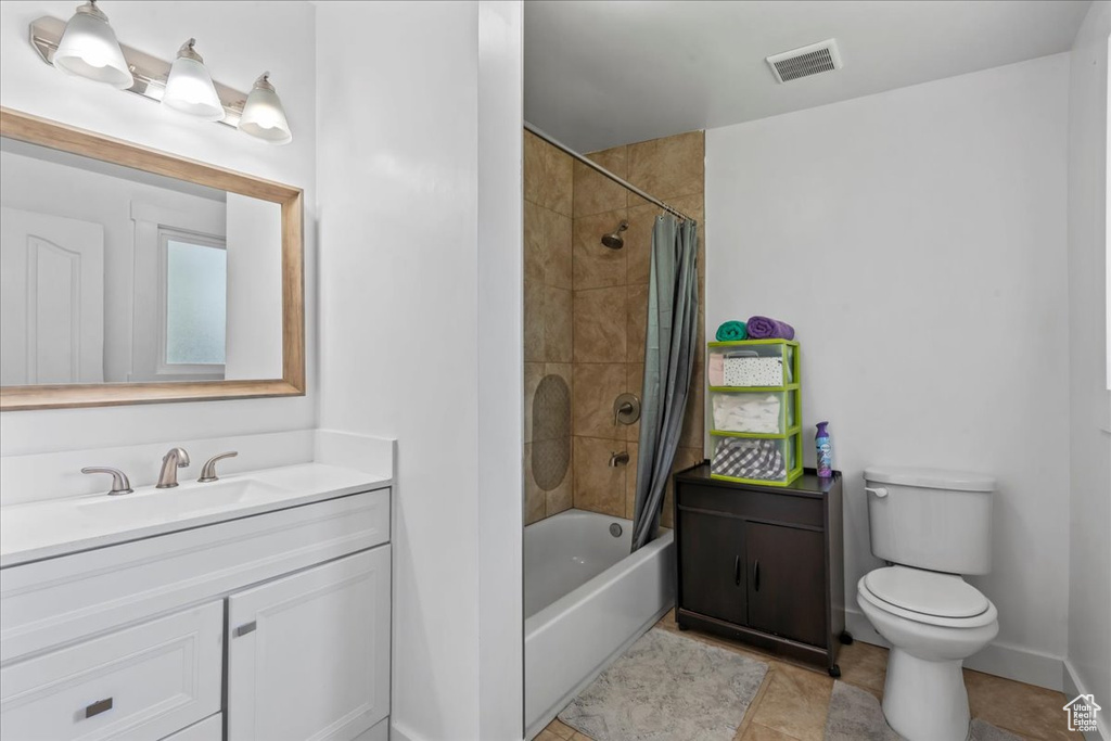 Full bath with vanity, shower / bath combination with curtain, and tile patterned flooring