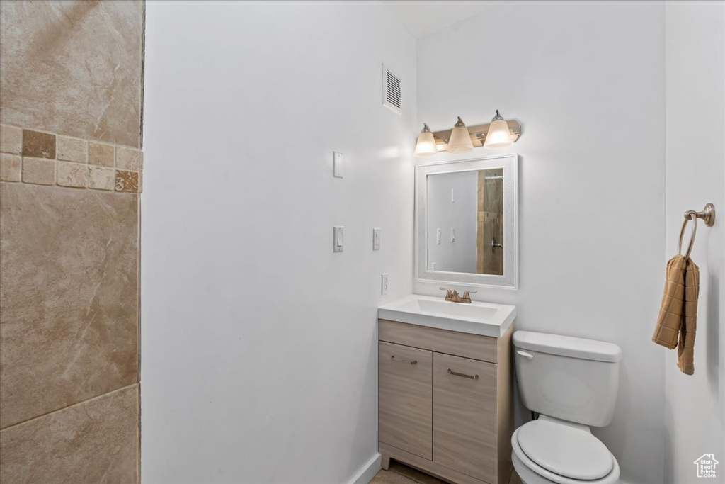 Bathroom featuring vanity and toilet