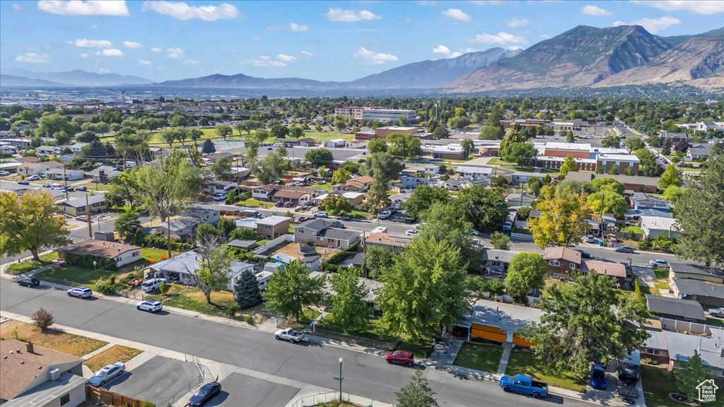Aerial perspective of suburban area with a mountainous background