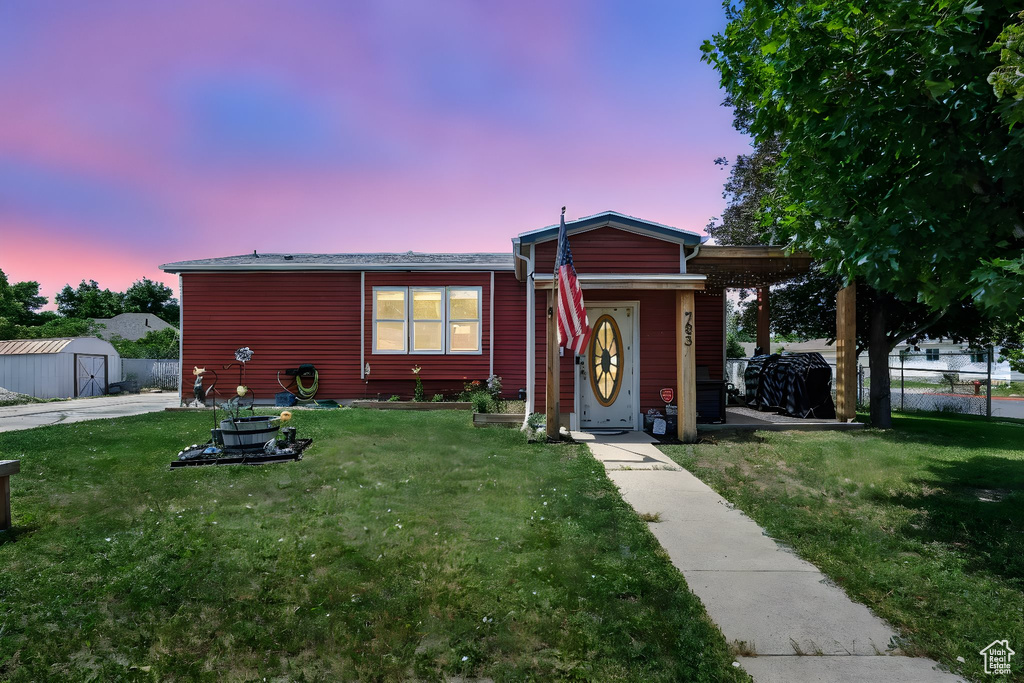 View of front of house with a shed