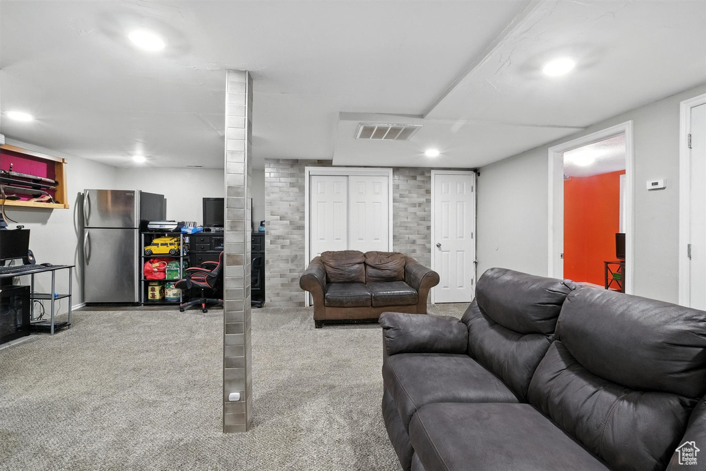 Living area with carpet and recessed lighting