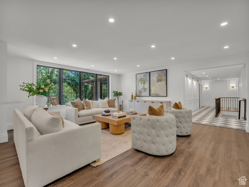 Living room with wood finished floors and recessed lighting