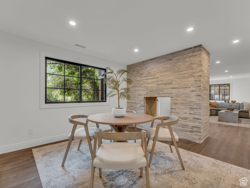 Dining room with plenty of natural light, recessed lighting, and wood finished floors