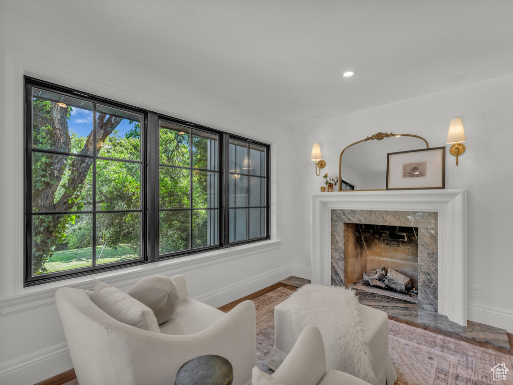 Living area with a fireplace and recessed lighting