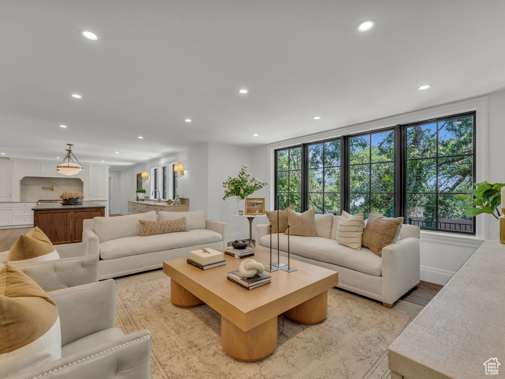 Living area featuring recessed lighting and light wood-style flooring