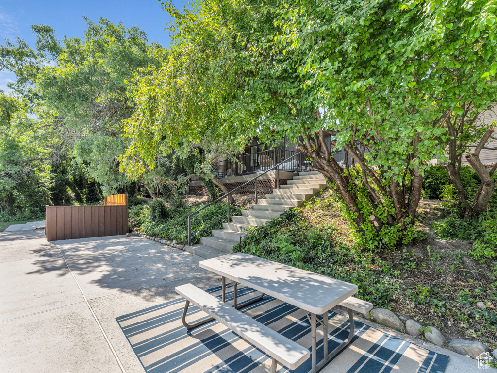 View of patio featuring stairway
