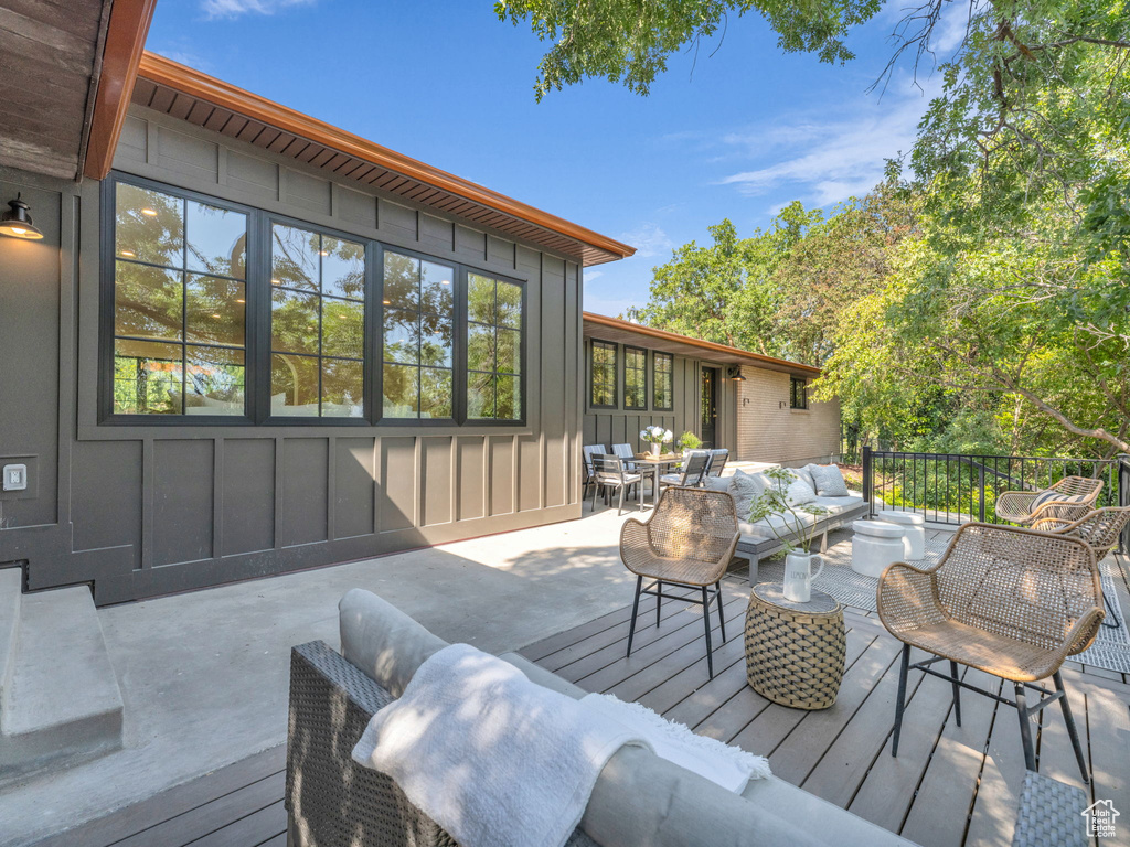 Wooden terrace with an outdoor hangout area