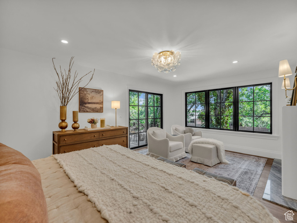 Bedroom featuring recessed lighting, a chandelier, and wood finished floors