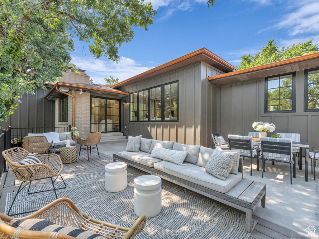 Deck featuring an outdoor living space and outdoor dining area