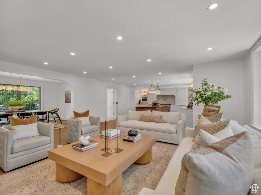 Living room with recessed lighting and arched walkways