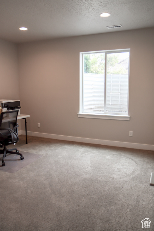 Carpeted office with baseboards and recessed lighting