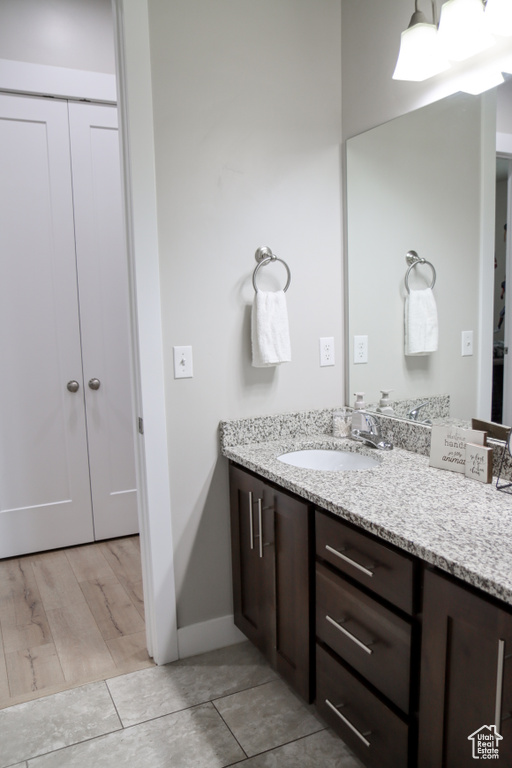 Bathroom featuring vanity and baseboards