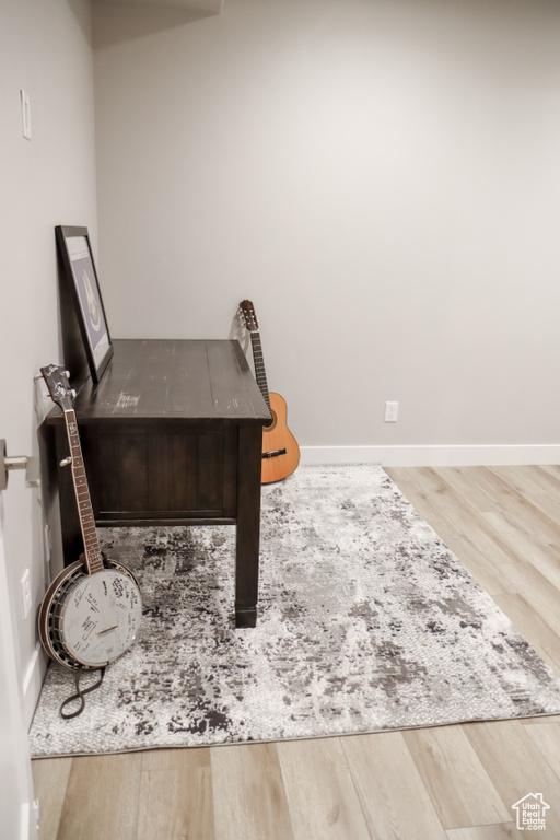 Office featuring wood finished floors and baseboards