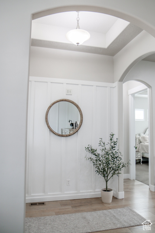 Detailed view of arched walkways, wood finished floors, and a decorative wall
