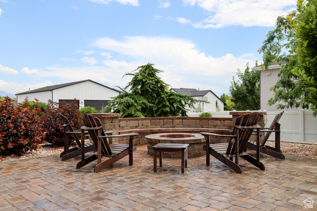View of patio featuring an outdoor fire pit