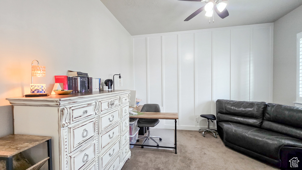 Office space with light colored carpet and a ceiling fan