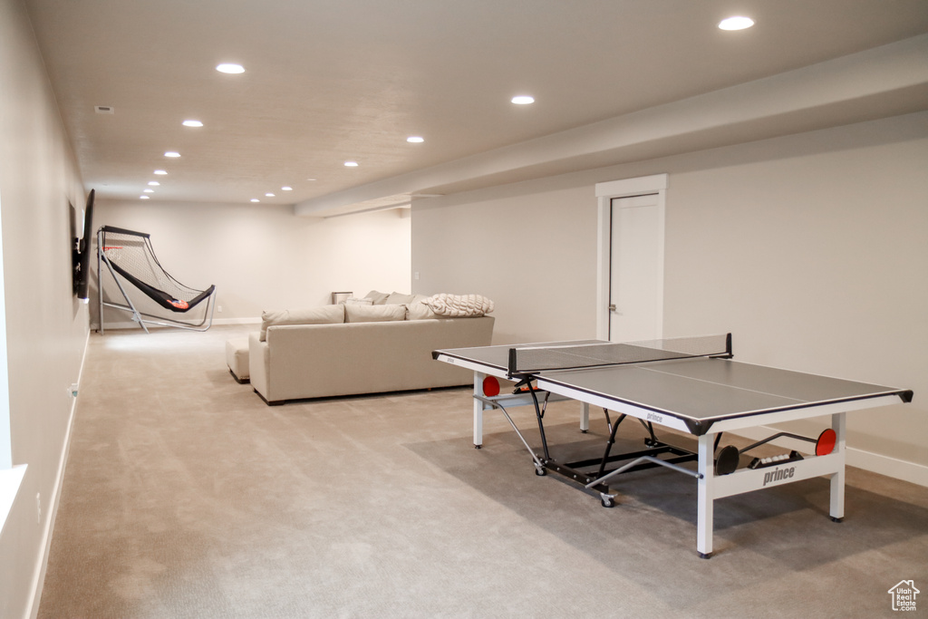Recreation room featuring recessed lighting and light carpet