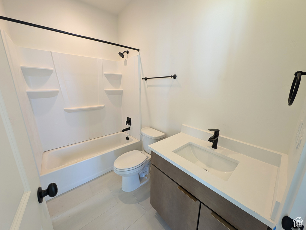 Full bath featuring shower / bath combination and vanity