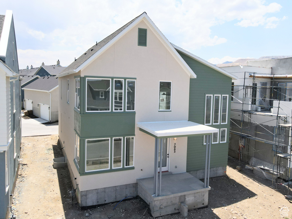 Back of property with stucco siding