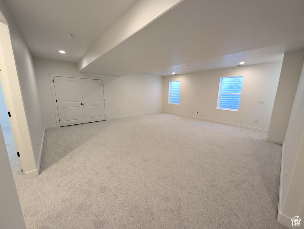 Basement featuring recessed lighting and carpet flooring