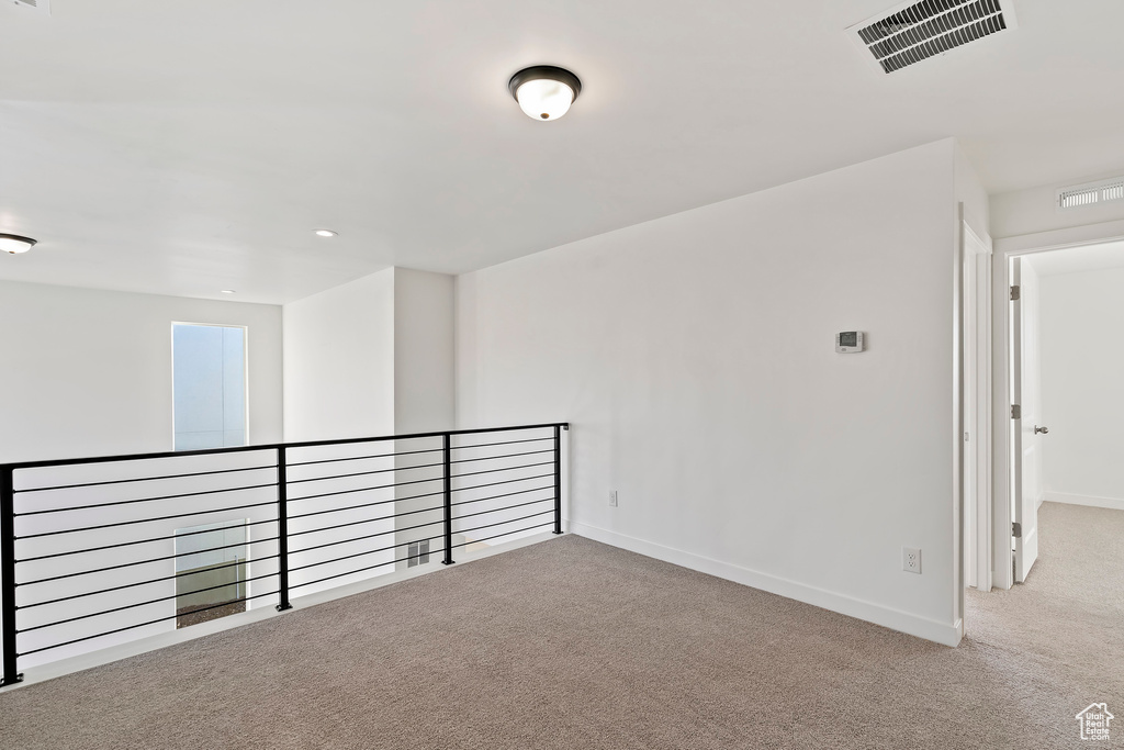 Spare room with carpet and recessed lighting
