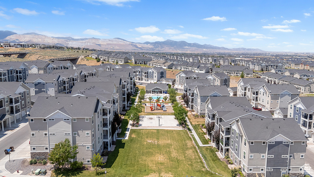 Aerial perspective of suburban area featuring a mountainous background