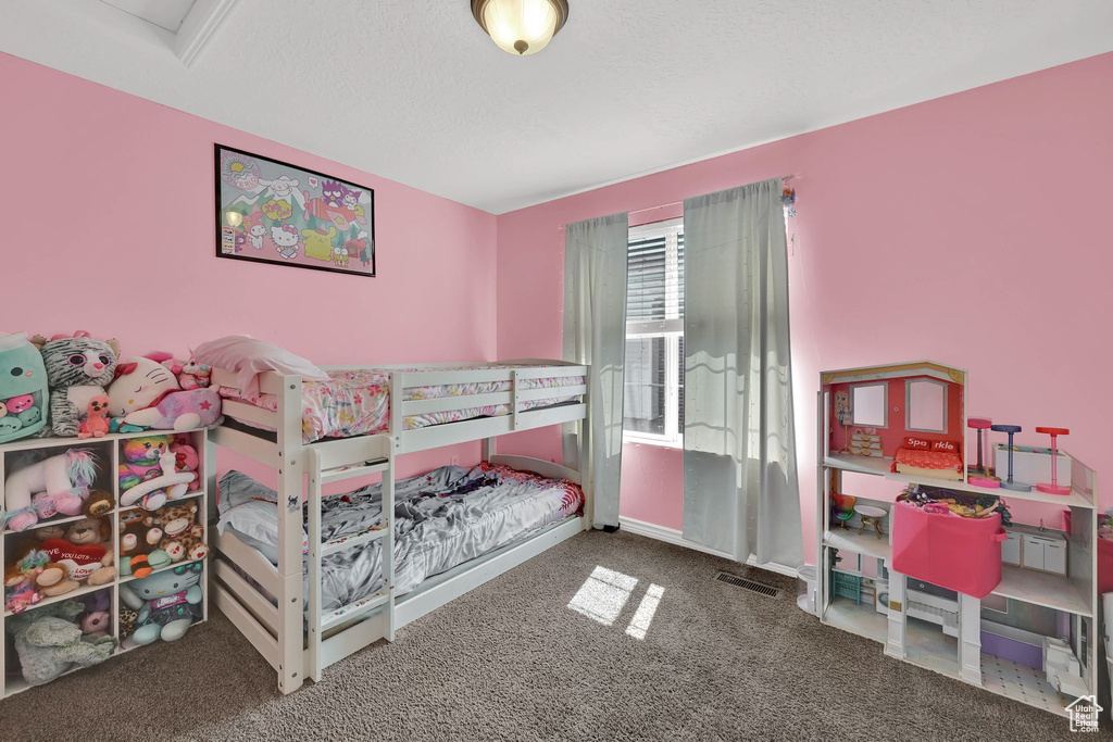 Carpeted bedroom with baseboards