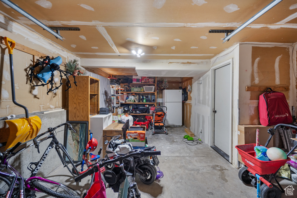 Garage with freestanding refrigerator