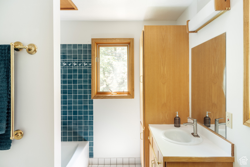 Full bathroom featuring vanity,  shower combination, and tile patterned flooring