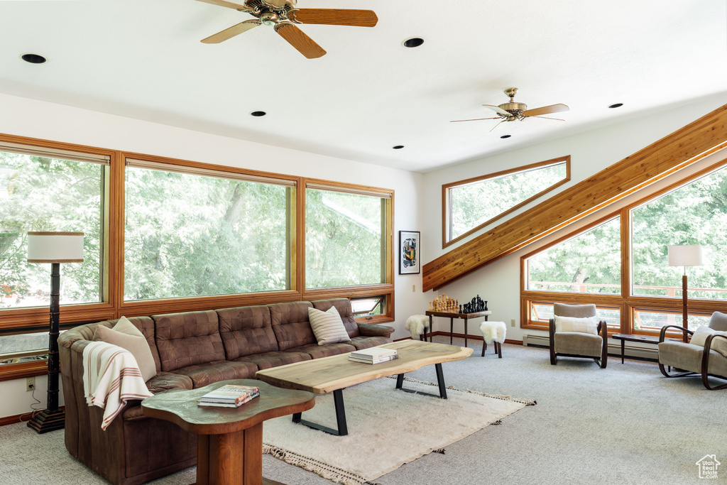 Living area featuring ceiling fan, light colored carpet, and recessed lighting