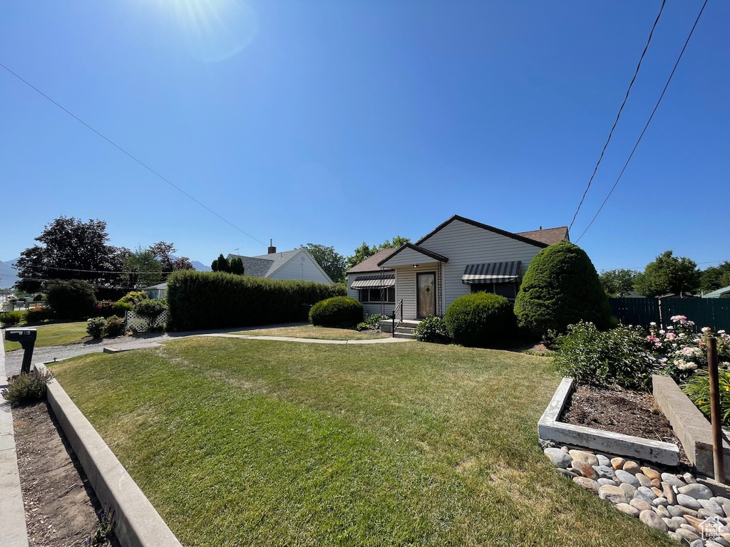 View of front of house with a garden