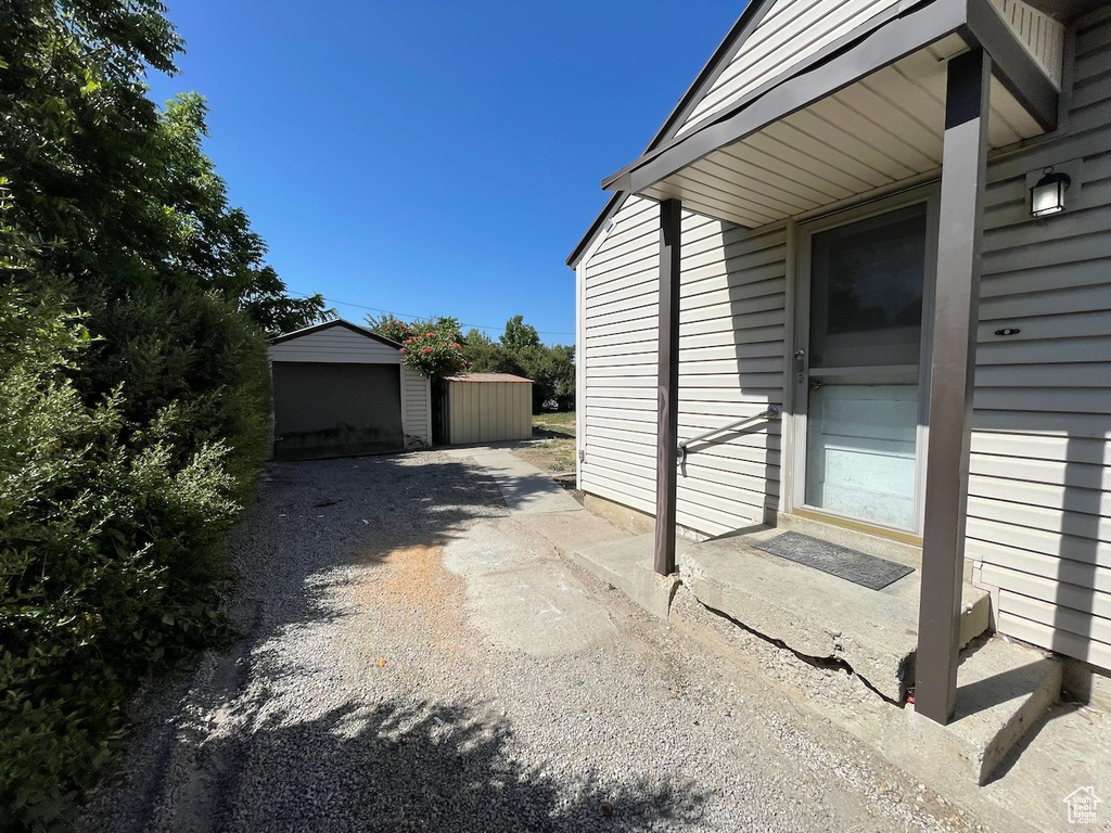 View of patio / terrace featuring a storage unit