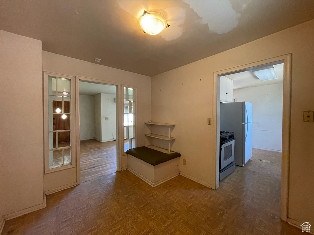 Hallway featuring baseboards