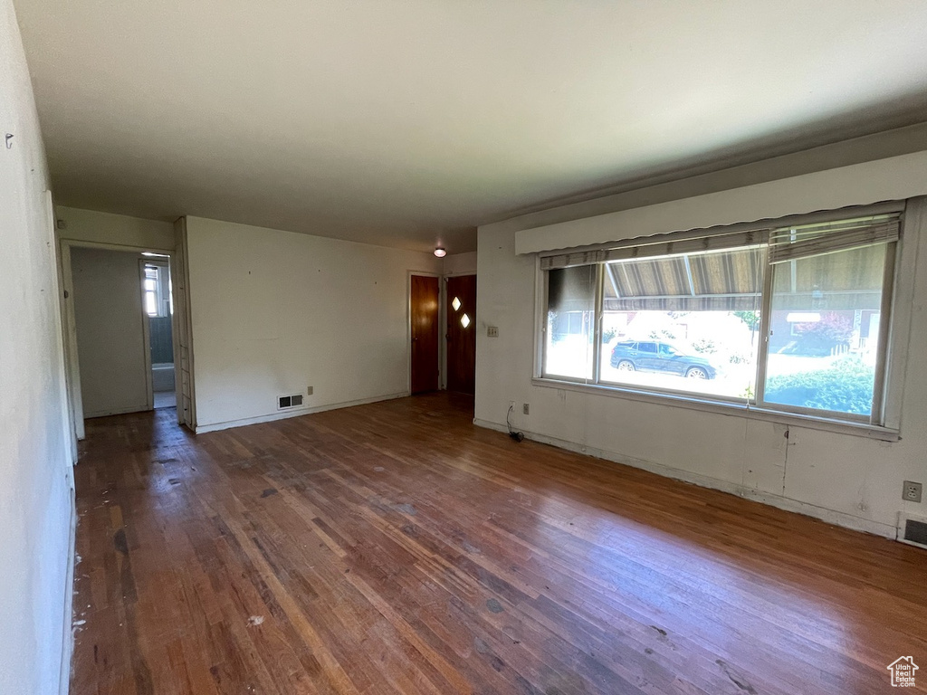 Unfurnished room with hardwood / wood-style flooring