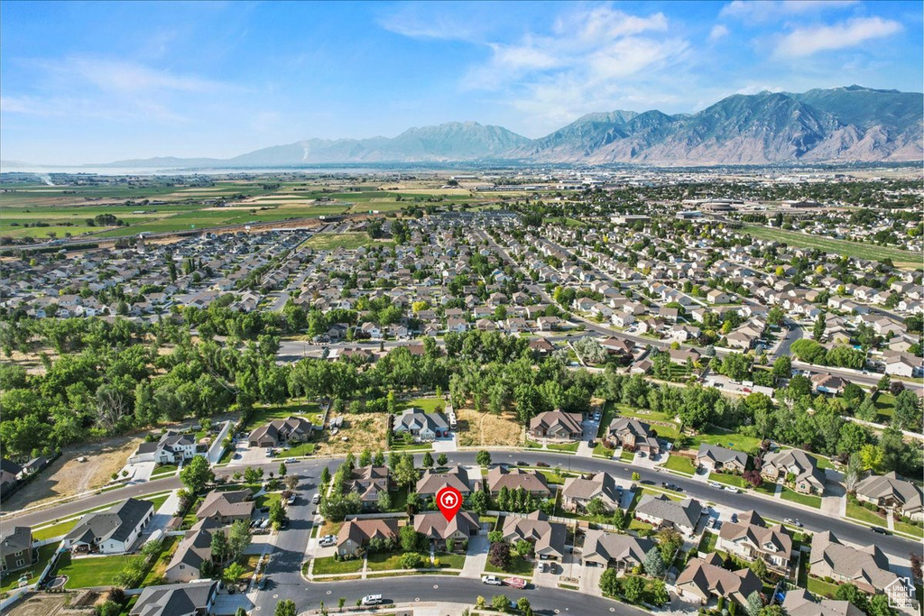 View of property location featuring a mountain backdrop and nearby suburban area