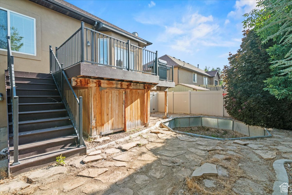 View of patio / terrace featuring stairway and a residential view
