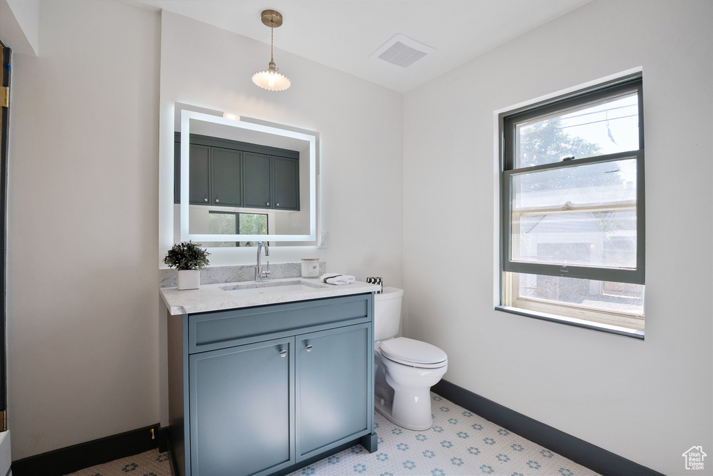 Bathroom featuring toilet and vanity
