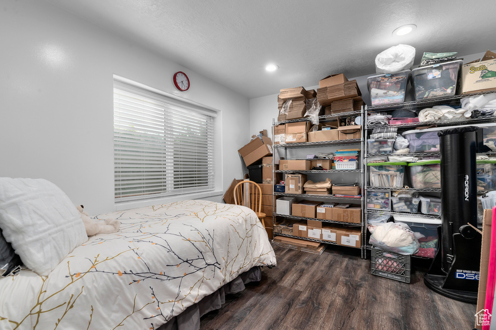 Bedroom with wood finished floors and recessed lighting