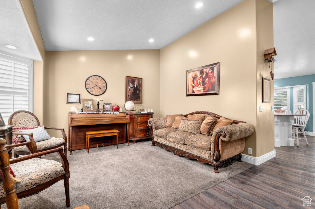 Living room with wood finished floors and recessed lighting