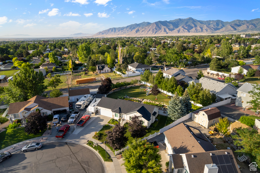 Aerial perspective of suburban area featuring a mountainous background