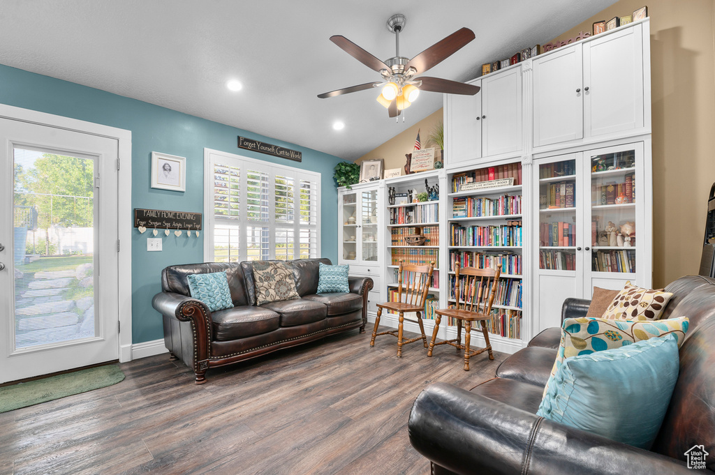 Living area with ceiling fan, wood finished floors, vaulted ceiling, and recessed lighting
